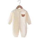 Newborn Pyjama Met Drukknopen En Lange Mouwen Creme Met Beer